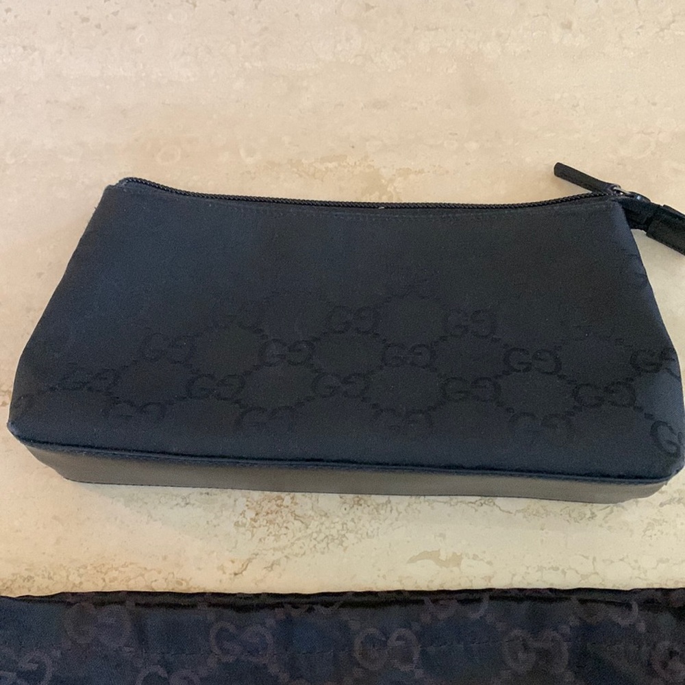 Gucci black canvas make up case. Matching pocketbook also up for sale.